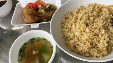 Overhead view of a vibrant Thai rice meal with multiple colorful dishes Stock Footage 317702127