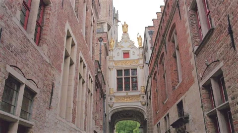 Overhead view walking through Blind Donkey Street arch, Bruges, Belgium Stock Footage 290215877