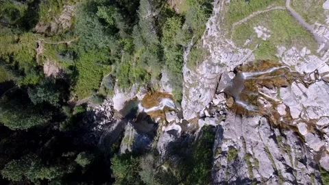 Overhead view of a waterfall, flying downwards along the stream. Video stock 152020335
