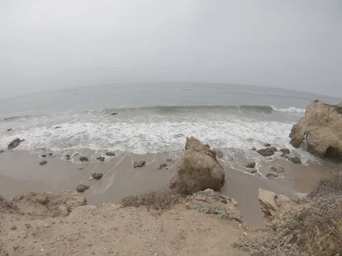 Overhead View of Waves Crashing onto Cloudy Coastal Beach 4k 4:3 Stock Footage 92931968