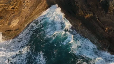An overhead view of waves crashing on the coast along the East side of Oahu. Stock Footage 200926669
