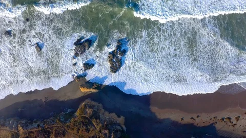 Overhead View, Waves Crashing Onto Ocean Rocks in Slow Motion Stock Footage 127581841