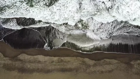 Overhead View of Waves Gently Lapping at the Seashore Stock Footage 293882264