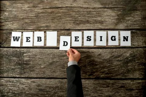 Overhead view of web designer assembling a Web design sign Stock Photos