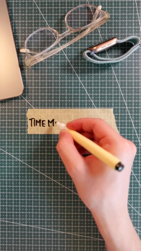 Overhead view of writing TIME MANAGEMENT on tape near smartwatch and glasses Stock Footage 338183676