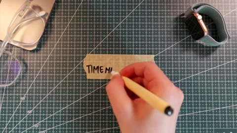 Overhead view of writing TIME MANAGEMENT on tape near smartwatch and glasses. Stock Footage 338183779