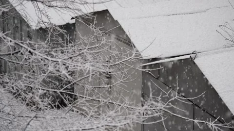 An overhead view of the yard of the car garages with the first white Stock Footage 257428071