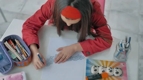 Overhead view of young man drawing pictures on paper and white tablee 스톡 동영상 130479472