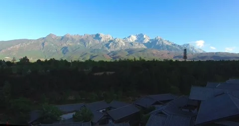 Overhead View of Yulong Snow Mountain at Dawn Lijiang China Video stock 336882453