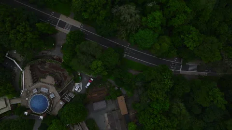 Overhead view of zoo structures and pathways surrounded by forest–ProRes 422HQ Stock Footage 311047888