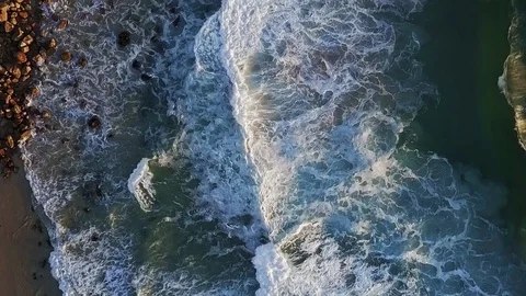 Overhead of waves crashing onto shore Stock Footage 71615254