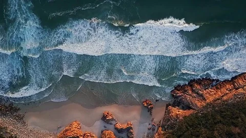 Overhead of waves crashing on shore Stock Footage 71615455