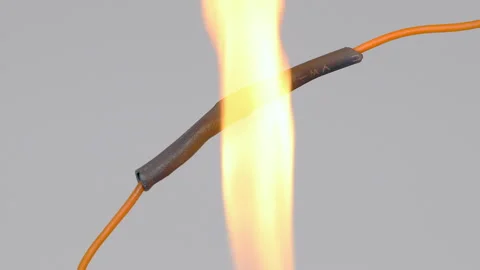 Overheating the black shrink tubing using a lighter flame. Stock Footage 306076116