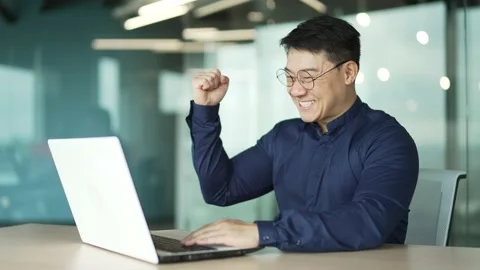 Overjoyed business man IT programmer extremely happy after read email message  Stock-Footage 225740060