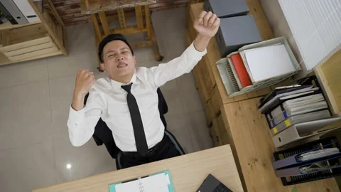 Overjoyed businessman is looking up Video stock 200447161