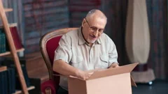 man unboxing cardboard box Tiffany & Co., Stock Video