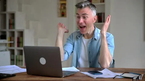 Overjoyed, gray-haired Caucasian freelancer, manager, dressed in casual clothes Stock Footage 166977021