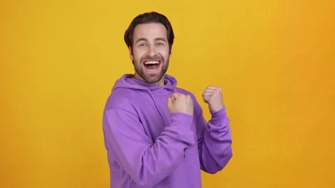 Overjoyed guy match lucky win yell gesture isolated bright color background Stock Footage 165863553