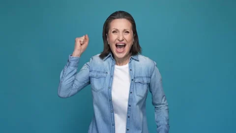 Overjoyed lady win million dollars fist up isolated blue color background Stock Footage 167319980