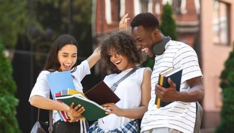 Overjoyed Multicultural Students Checking Exam Results And Celebrating Success Foto stock