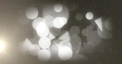Overlapping bokeh discs producing bright triangular flares during camera pan, Stock Footage 329594288