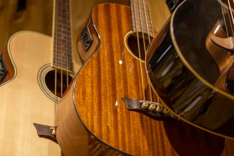 Overlapping guitars on wall Stock Photos
