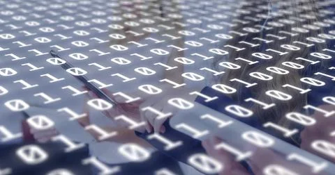 Overlaying binary digits covering office desk, team tapping laptop tablet stylus Foto stock