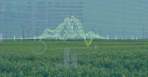 Overlaying digital line graph on open farmland, with wind turbines and numeric Stock Photos