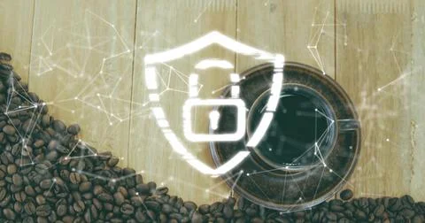 Overlaying glowing shield with padlock centering over cafe table, with coffee Stock Photos