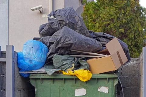 Overload garbage dumpster waste Stock Photos
