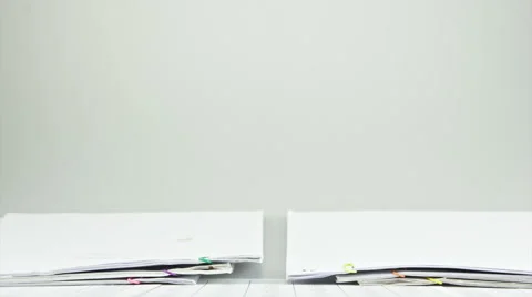 Overload old paperwork report on table time lapse Stock Footage 48568145