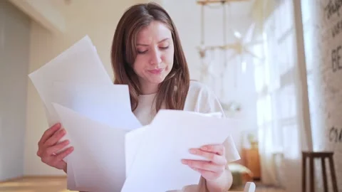 Overload with paperwork. Employed worker on the remote work at home 库存影片 148944592