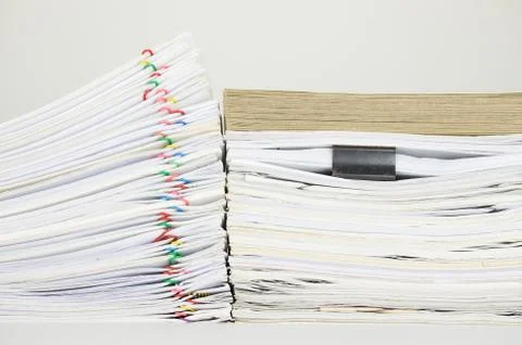 Overload paperwork have brown envelope on document with white background Stock Photos