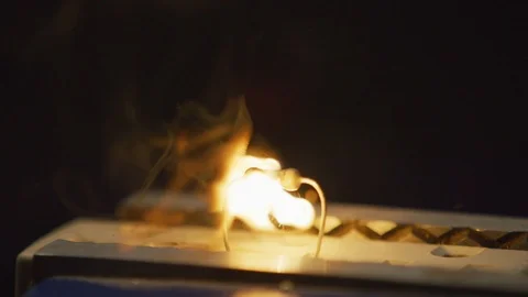 Overloaded Electronics Resistor Bursts Into Flame Slow Motion RED 4K Stock Footage 114125769