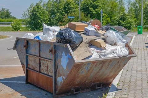 Overloaded Skip Trash Stock Photos