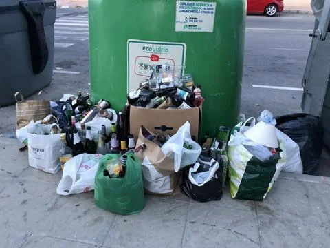 Overloaded trash containers Stock Photos