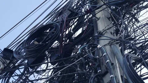 Overloaded utility pole with electrical wiring and communication lines. Stock Footage 323901912