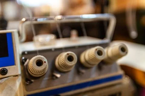 Overlock knobs in a sewing workshop Stock Photos
