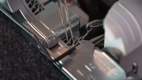 Overlock Sewing Machine. Close up stitches in slow motion Stock Footage 108861920