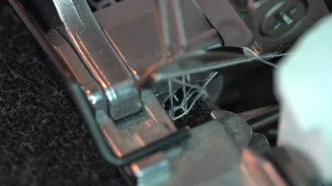 Overlock Sewing Machine. Close up stitches in slow motion Stock Footage 120545153