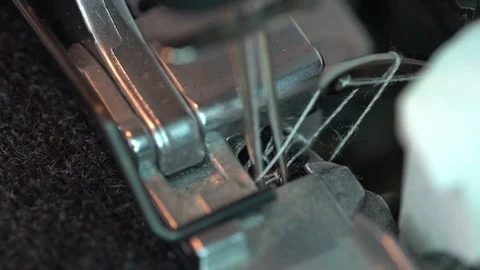 Overlock Sewing Machine. Close up stitches in slow motion Video stock 123061769