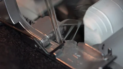 Overlock Sewing Machine. Close up stitches in slow motion Video stock 124532961