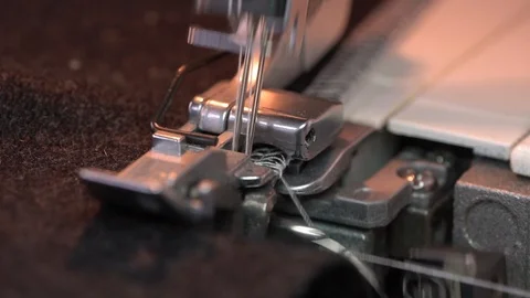 Overlock Sewing Machine. Close up stitches in slow motion Video stock 124939567