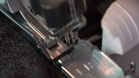 Overlock Sewing Machine. Close up stitches in slow motion Video stock 126078719