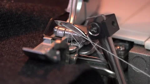 Overlock Sewing Machine. Close up stitches in slow motion Stock Footage 131221693