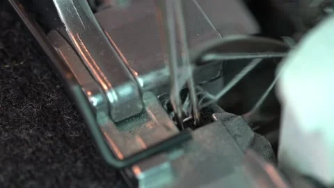 Overlock Sewing Machine. Close up stitches in slow motion Video stock 137444903