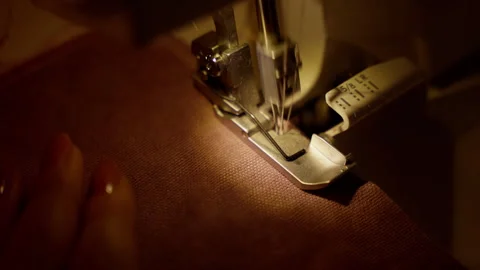 Overlock Sewing Machine Stitching Hem on Fabric. Precision hemming with an Video stock 264386726