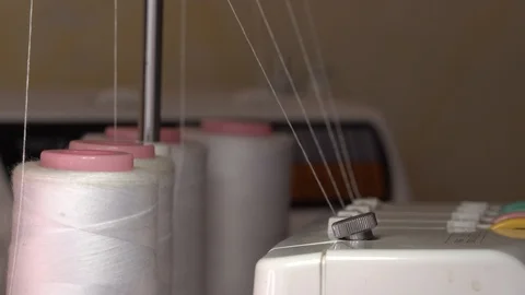 Overlock Sewing Machine with white thread spools Stock Footage 108862102