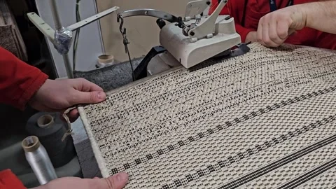 Overlocking a Carpet on a Sewing Machine Stock Footage 296097651