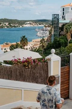 Overlook of Mahon Harbor with Glass Elevator and Tourist, Menorca Stock Photos
